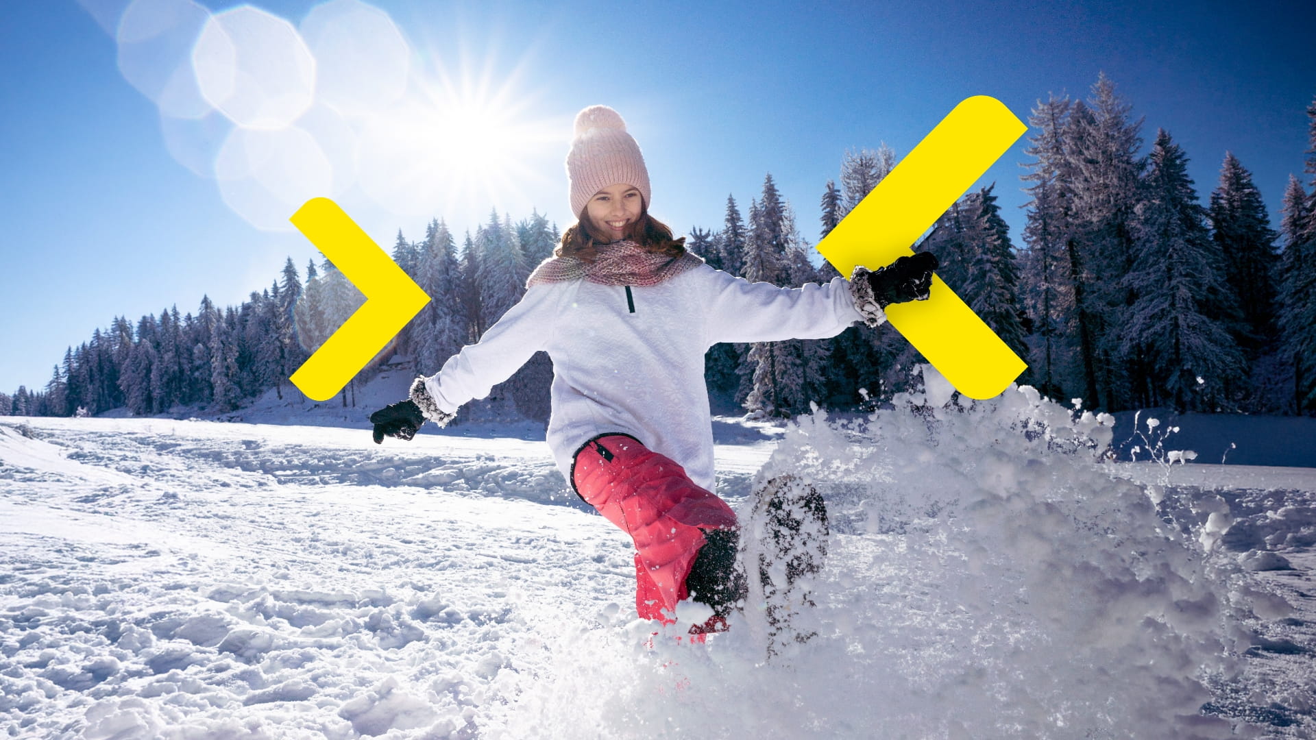 žena skáče do sněhové závěje.